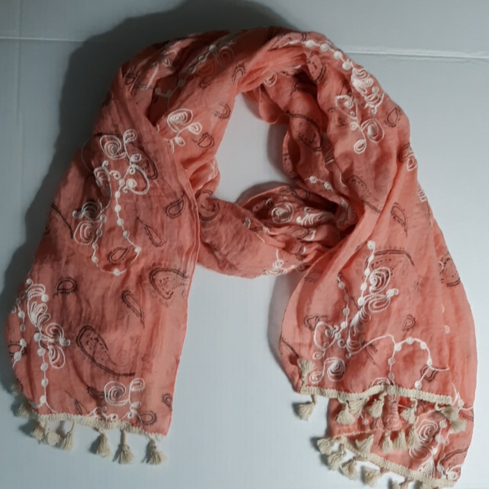 Peach colored scarf with cream color embro…